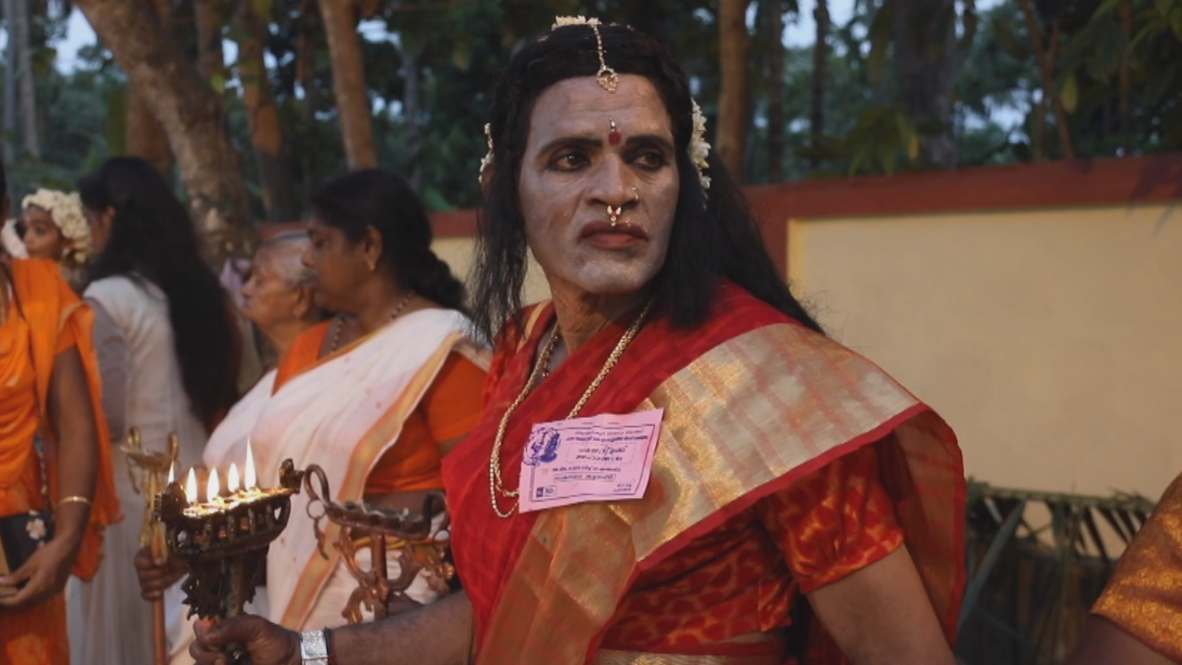 Damsel in a dress! Thousands of men doll up for Hindu festival in Kerala