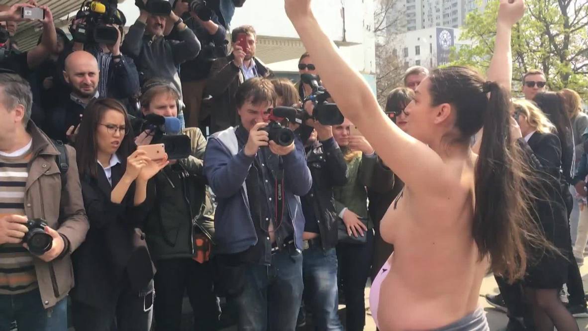 Ukraine: ‘Stop raping our country’ - FEMEN activist protests outside Zelenskiy polling station *EXPLICIT*