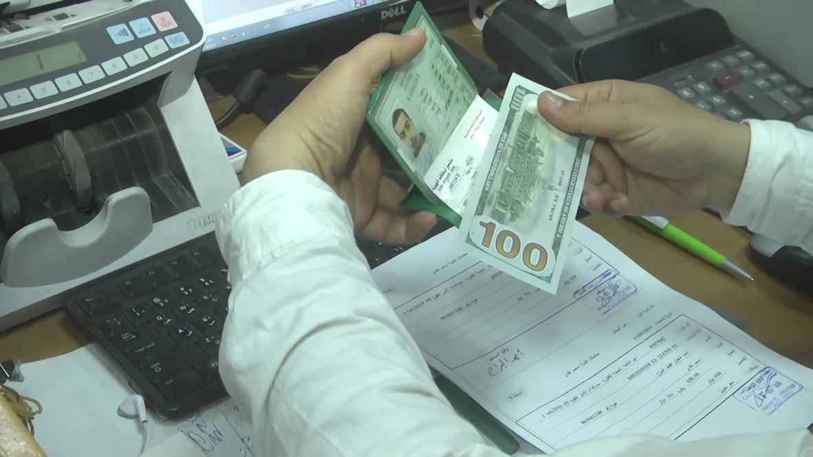 State of Palestine: Gazans queue to receive $100 grants from Qatar