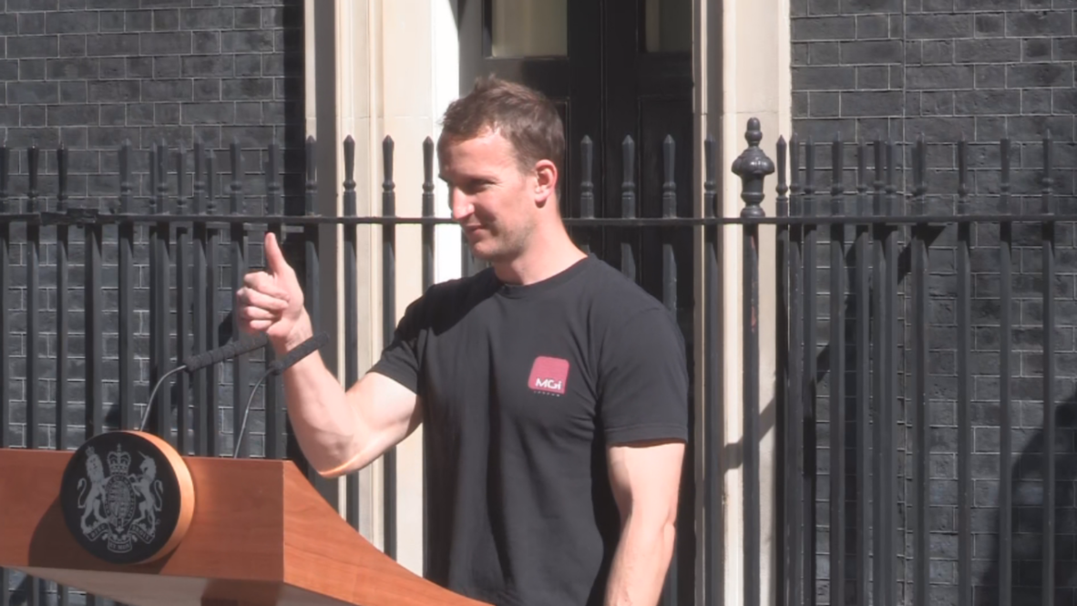 Hot 'podium guy' upstages Theresa May's resignation speech