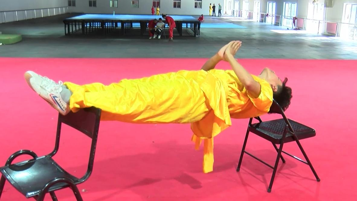 Shaolin monks perform BACKBREAKING feats of strength at Beijing demo