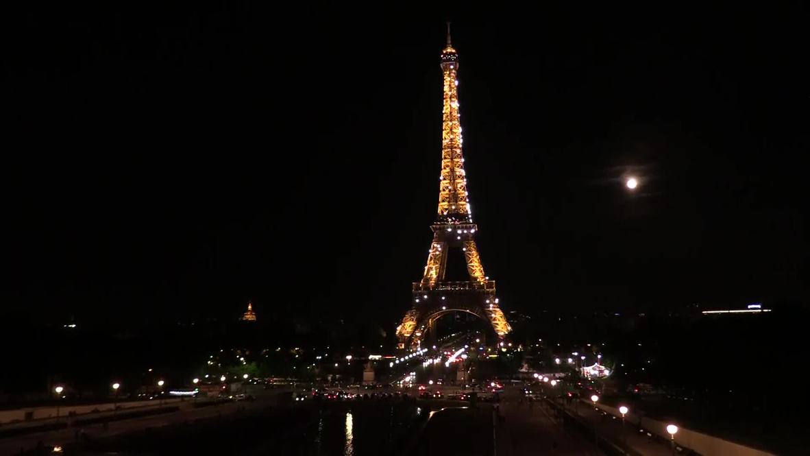 Strawberry moon shines over Eiffel Tower
