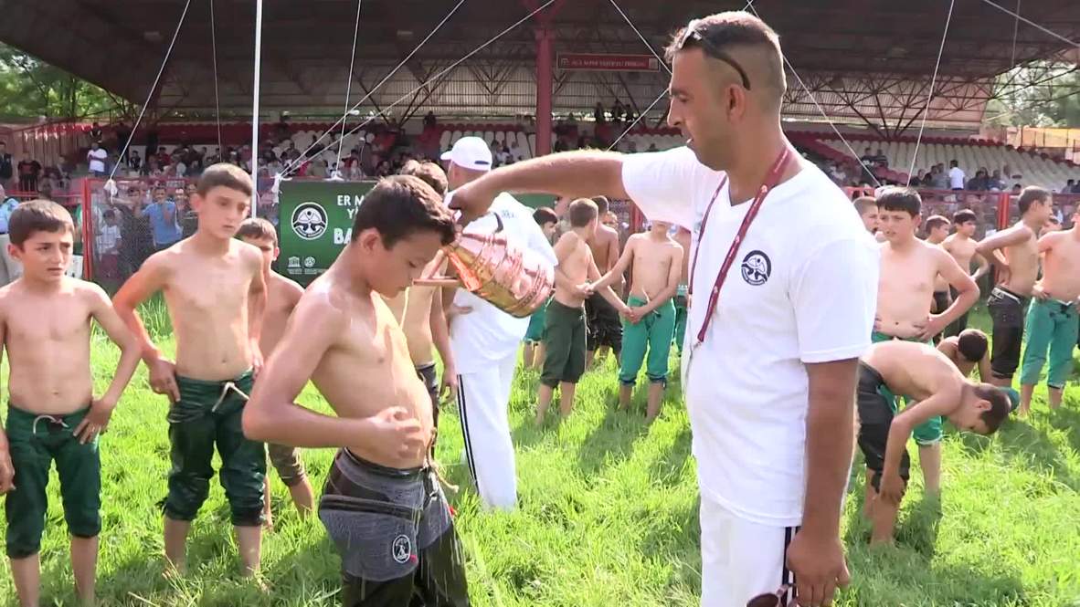 Turkish wrestlers oil up and pin each other down