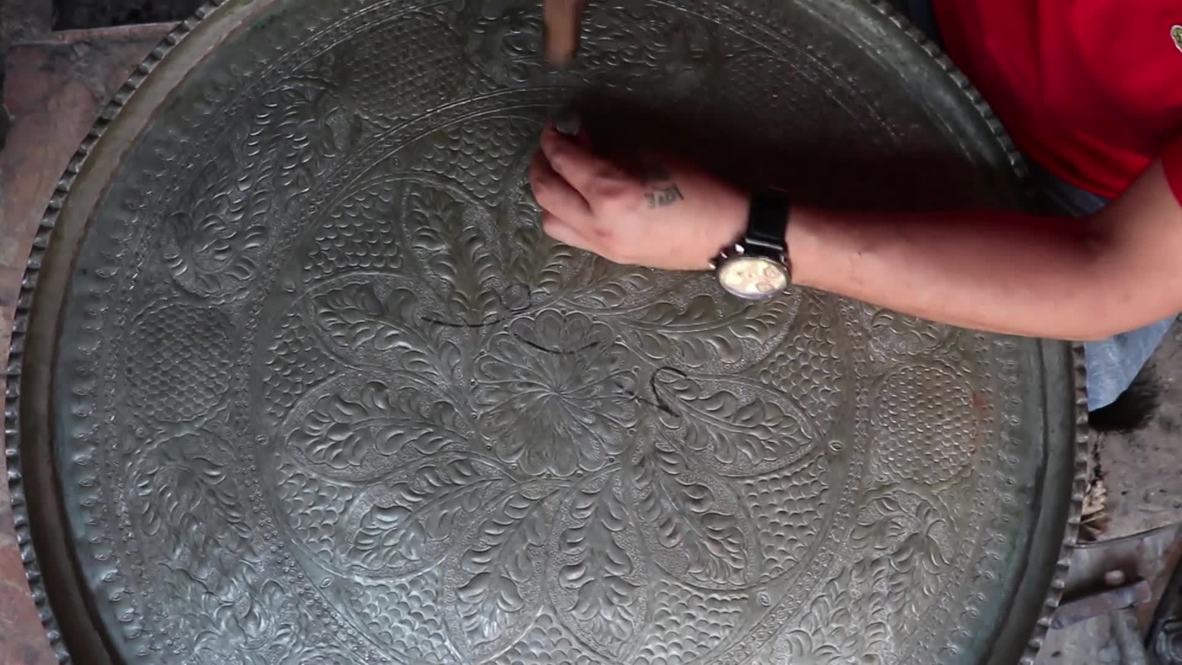 Syria: Aleppo's ancient coppersmiths' market comes back to life after restorations