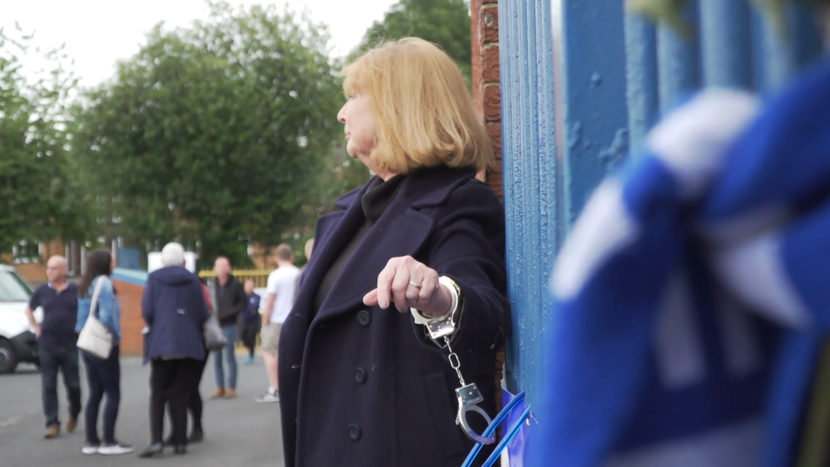 UK: Ex-Bury FC director handcuffs herself to railings outside stadium