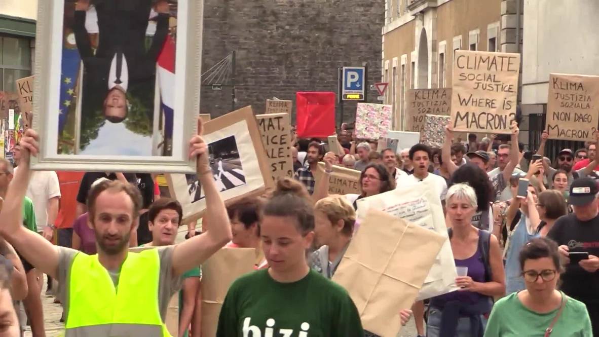 France: Climate activists rally in Bayonne carrying upside down Macron portraits