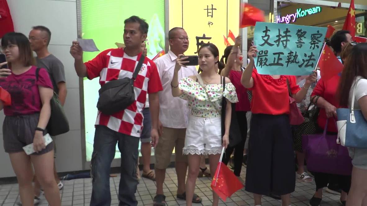 Hong Kong: Police arrest protesters as opposing rallies face off