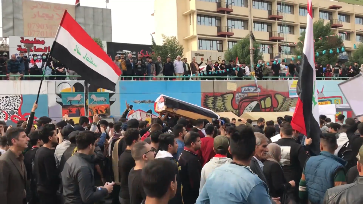 Iraq: Protesters carry empty coffins to commemorate victims of crackdown