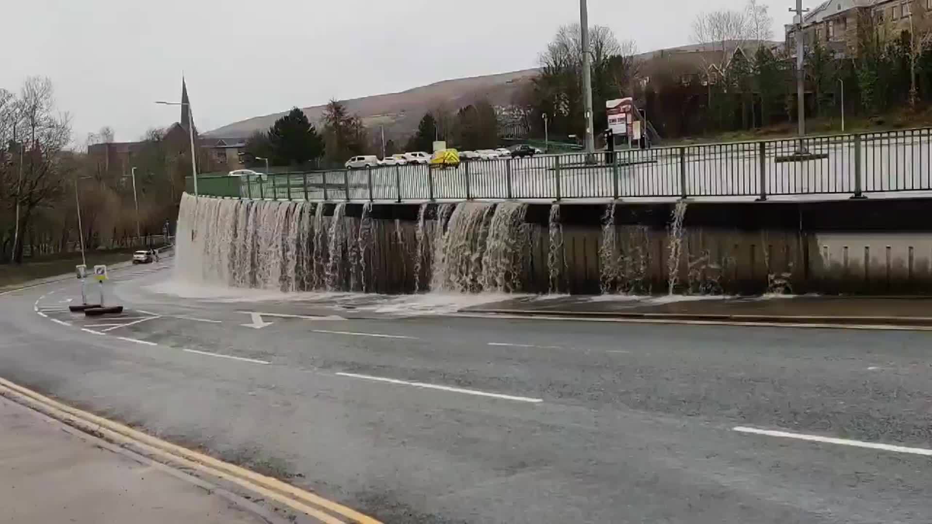 UK Storm Dennis causes 'waterfall' floor at Pontypridd car park