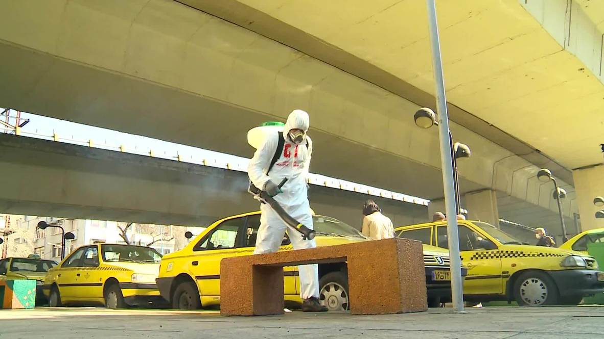 Iran: Workers seen disinfecting Tehran taxi rank amid COVID-19 response