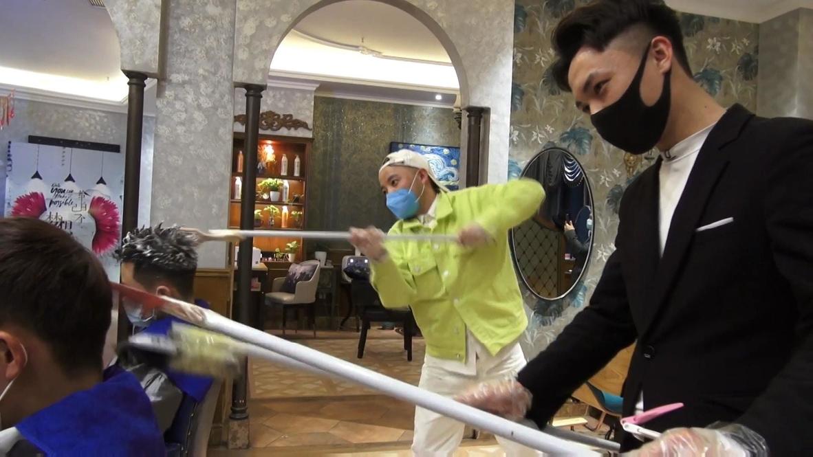 Slikovni rezultat za Chinese barbershop uses metre-long sticks to keep distance with customers amid coronavirus