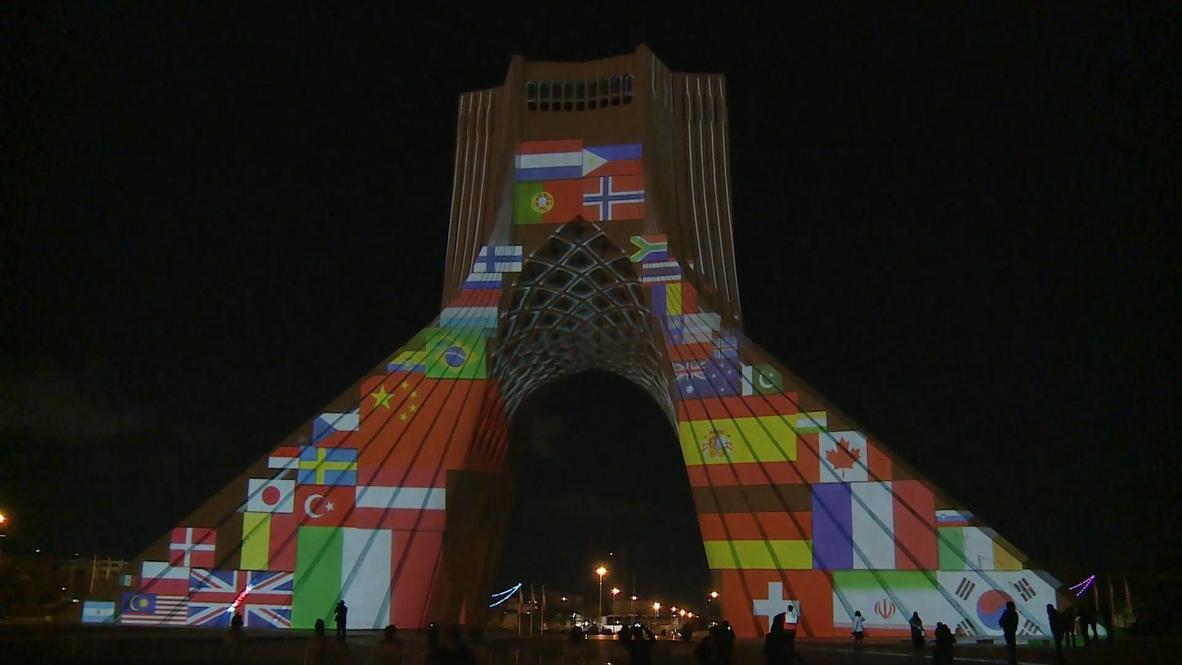 Iran: Tehran's Azadi Tower lit up with messages of solidarity amid coronavirus crisis