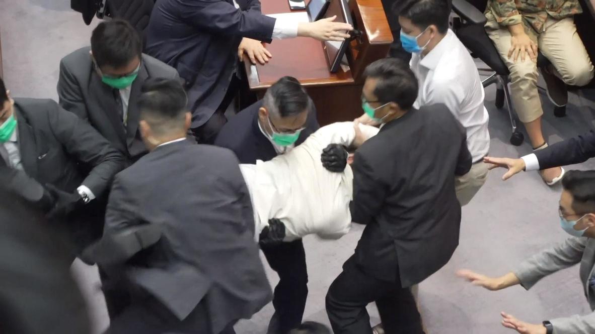 Hong Kong: Opposition members scuffle with pro-Beijing politicians over key appointment