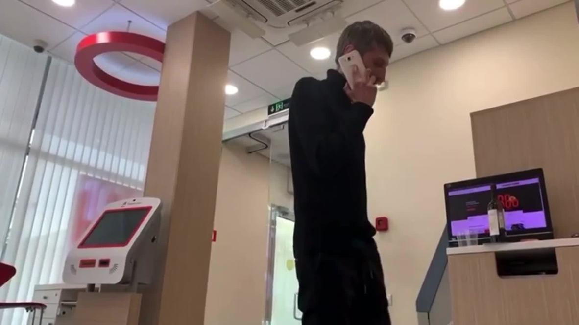 Russia: 'Mama, let’s talk later' - Hostage films Moscow bank attacker's phone call *EXCLUSIVE*