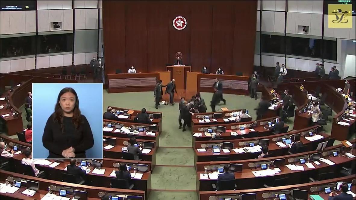 Hong Kong: Pro-democracy lawmakers forced out of Legislative Council meeting