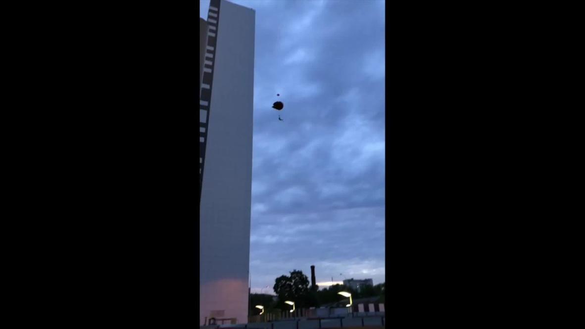Russia: See daredevils BASE jump off Moscow tower block