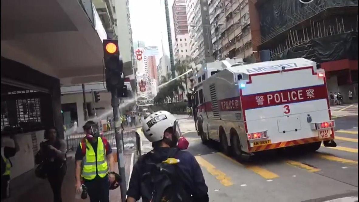 Hong Kong: Police detain dozens, use water cannon against protesters