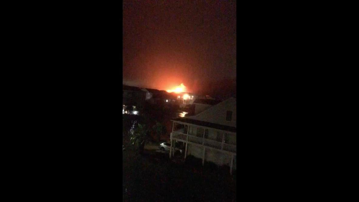 USA: Large fire in residential area during Hurricane Isaias