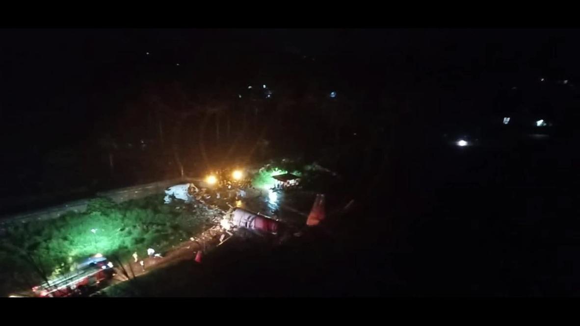 India: Emergency services work at scene of plane crash *STILLS*