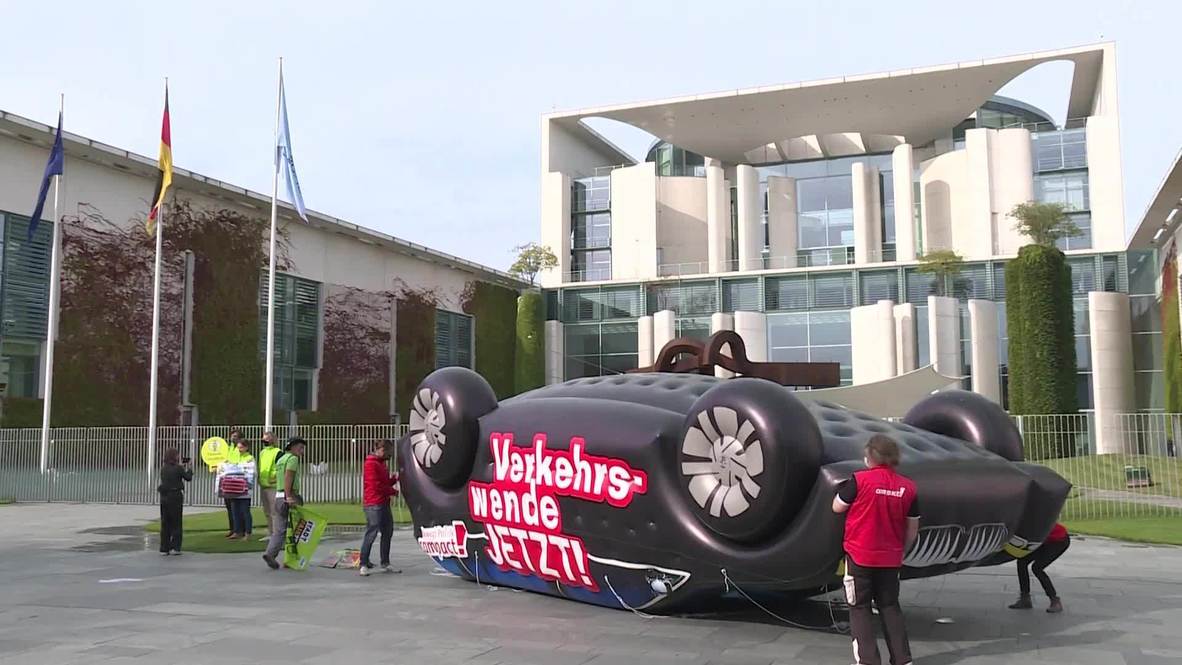 Germany: Environmental activists protest yearly auto summit outside Chancellery in Berlin