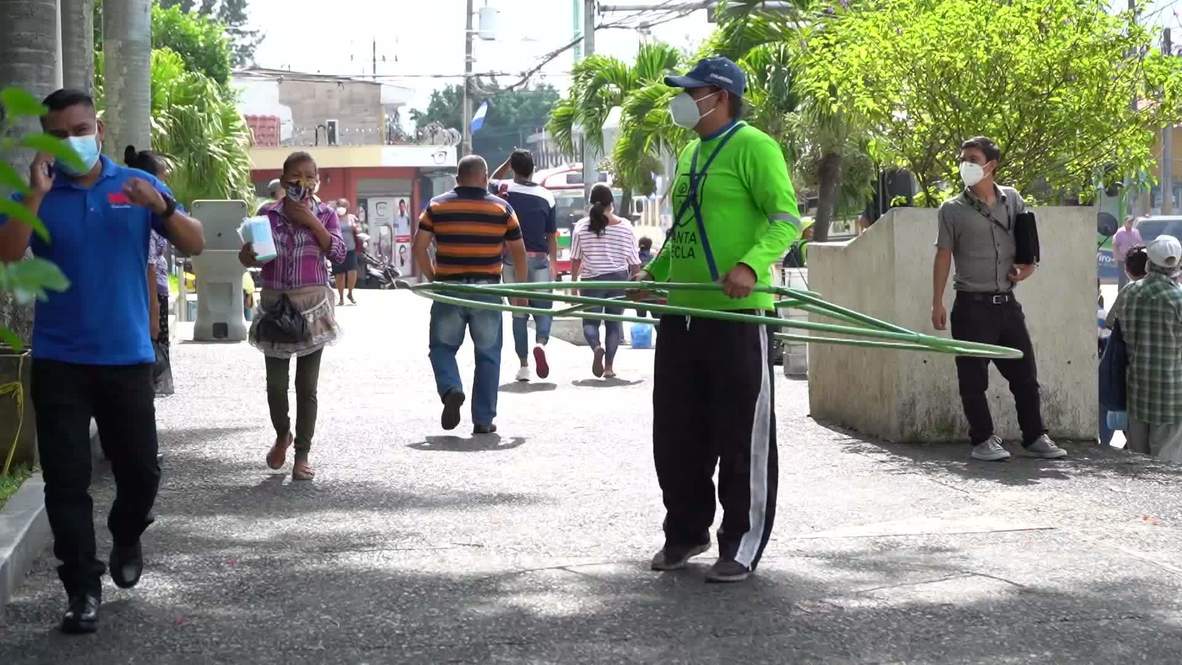 El Salvador volunteers wear HOOP to promote social distancing