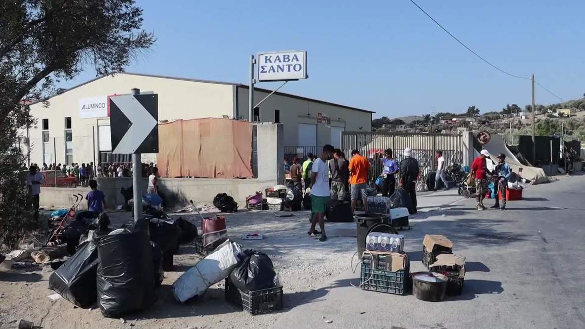 Greece: Volunteers distribute supplies to migrants living outside ruined Moria camp