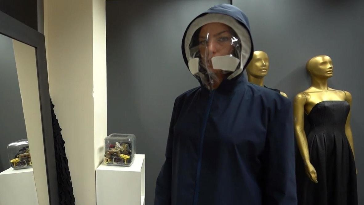 Italian fashion designer creates anti-COVID trench coat with transparent visor