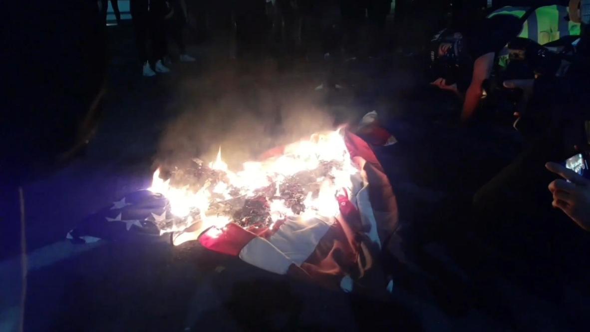 USA: BLM protesters burn US flag during Portland demo