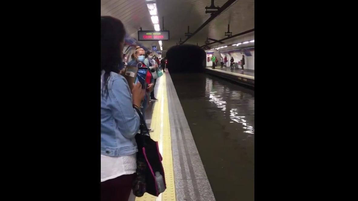 Spain: Dramatic footage of heavy rain flooding Madrid metro tracks and exit