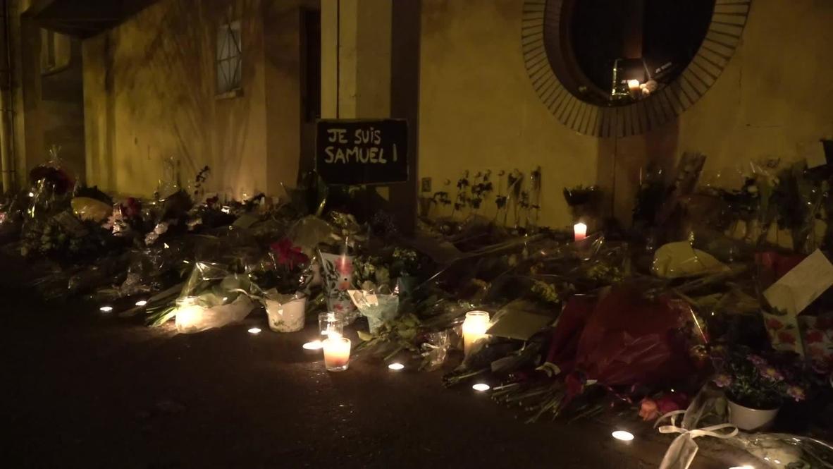 France: Candles and flowers laid at gates of college in Paris suburb in memory of beheaded teacher