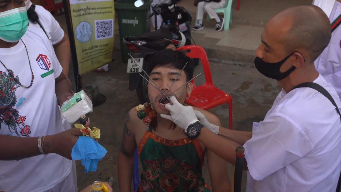 Thailand: Devotees pierce their flesh with skewers at Phuket vegetarian festival *GRAPHIC*