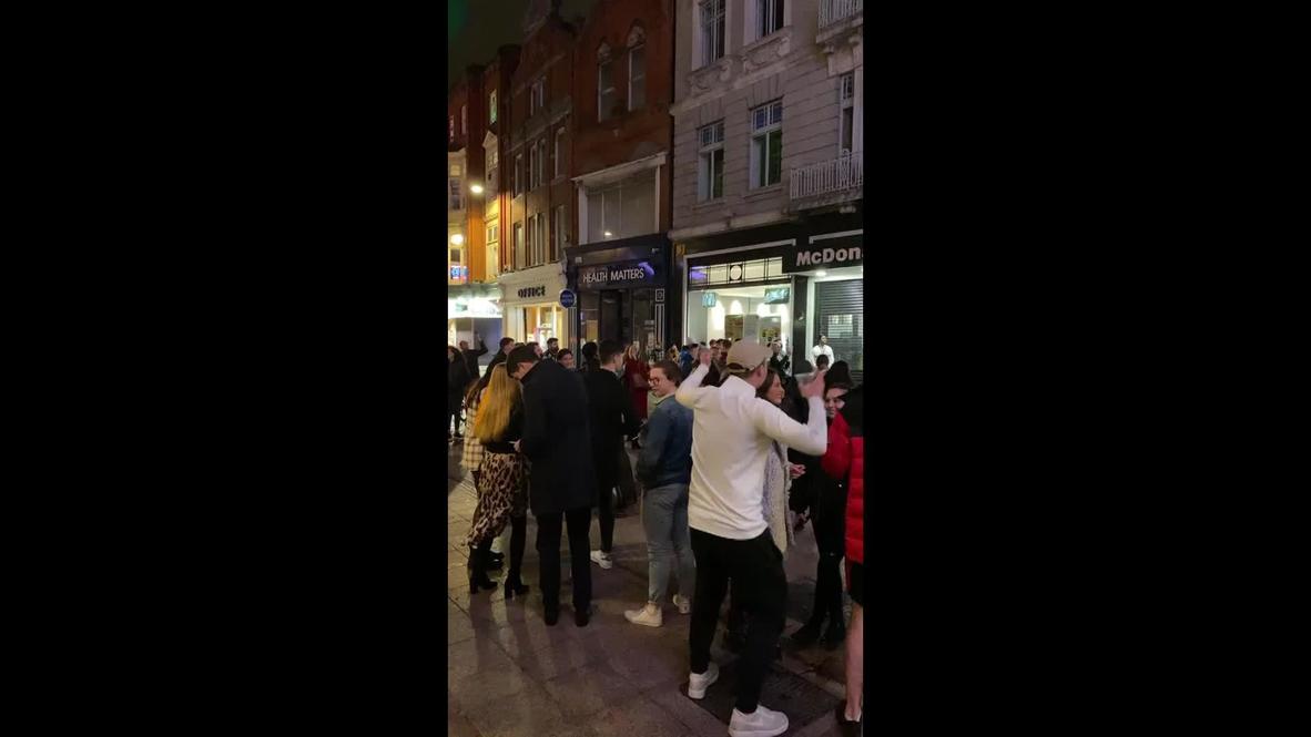 Ireland: Dubliners sing and dance at impromptu gathering on eve of lockdown