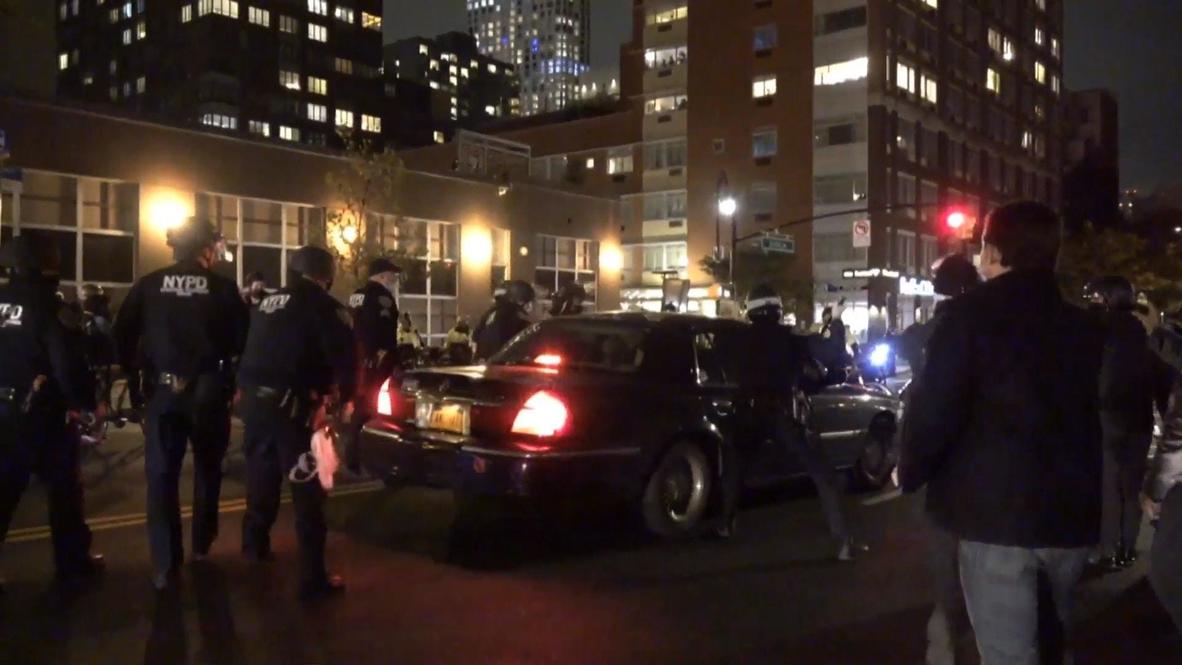 USA: Car drives through line of police amid chaotic Brooklyn protest