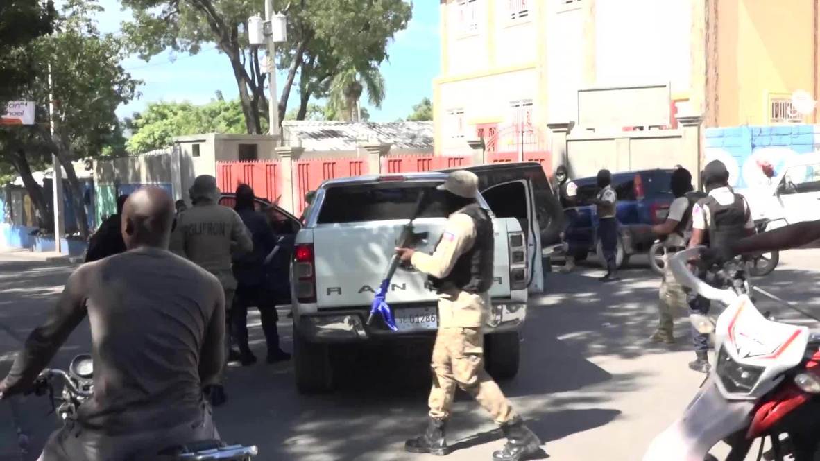 Haiti Police officers burn govt cars in protest over pay in PortauPrince Video Ruptly