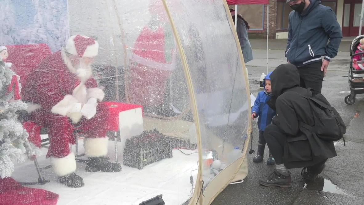Seattle Santa safely spreads Xmas cheer from inside life-size snow globe