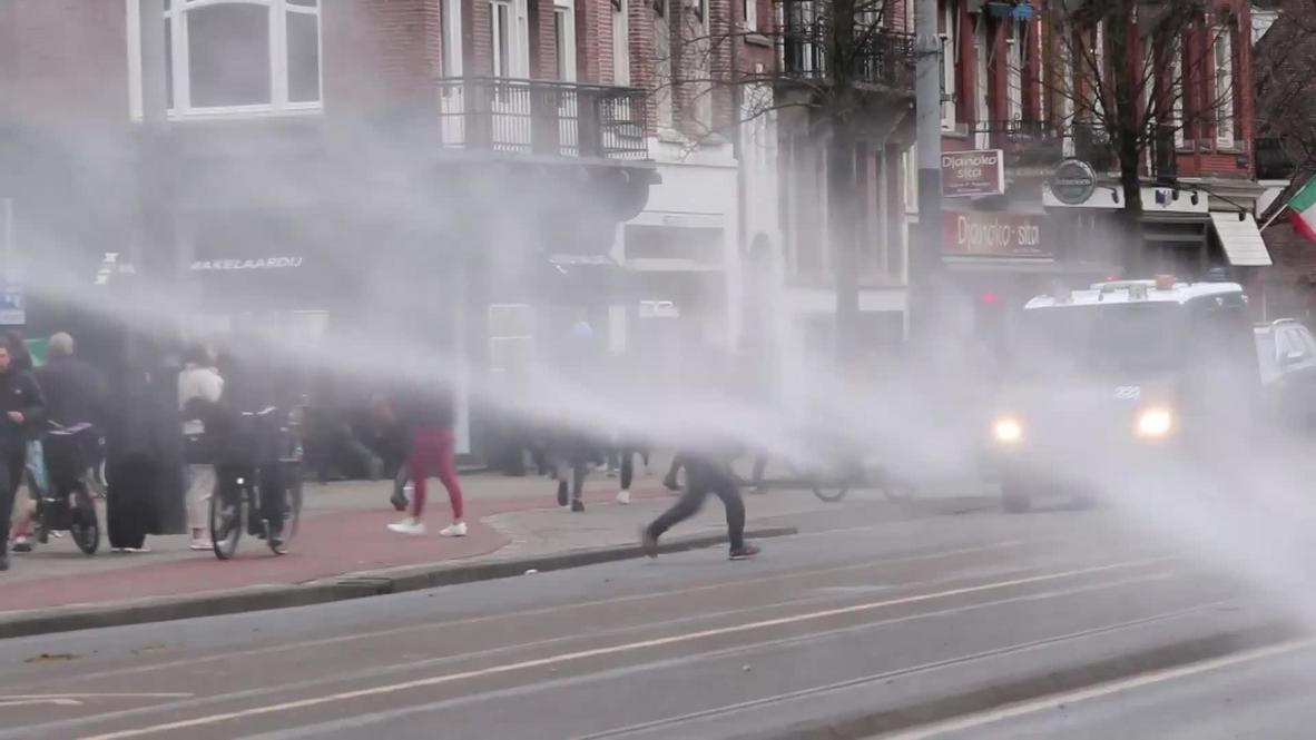 Netherlands: Police use water cannon to disperse COVID protest in Amsterdam