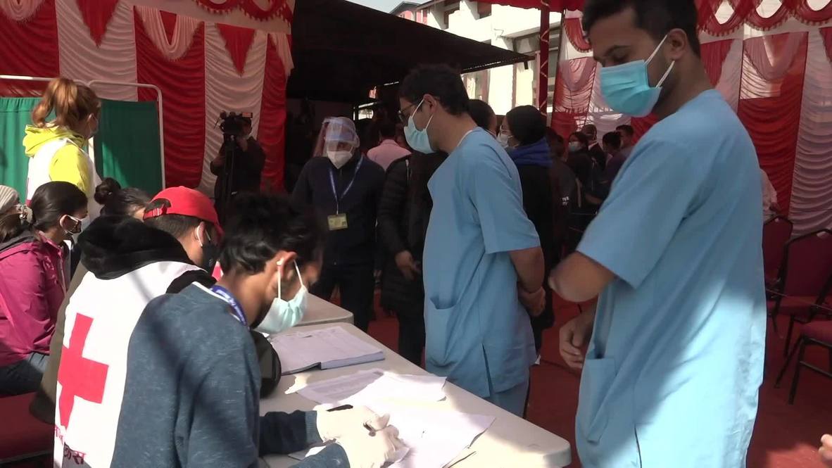 Nepal: Kathmandu health workers get first jabs at the start of vaccination campaign
