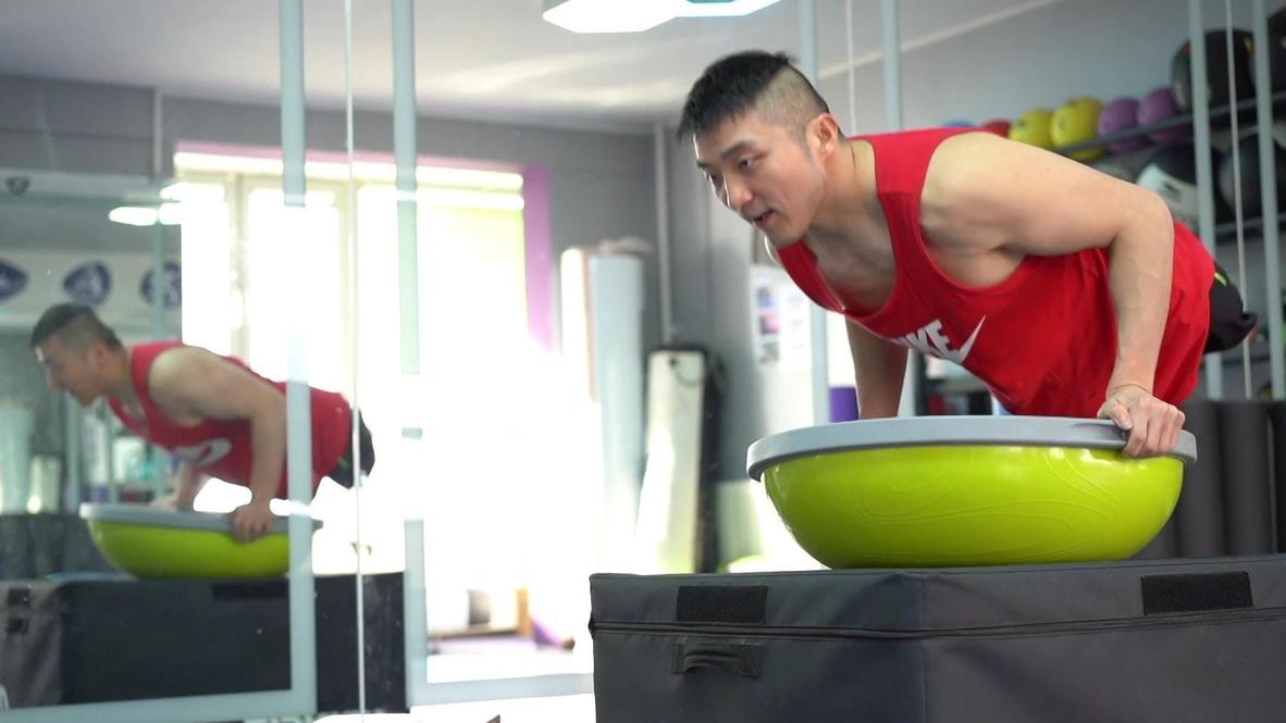 No legs, no excuses, no giving up. Legless Chinese fitness instructor inspires thousands with workout videos