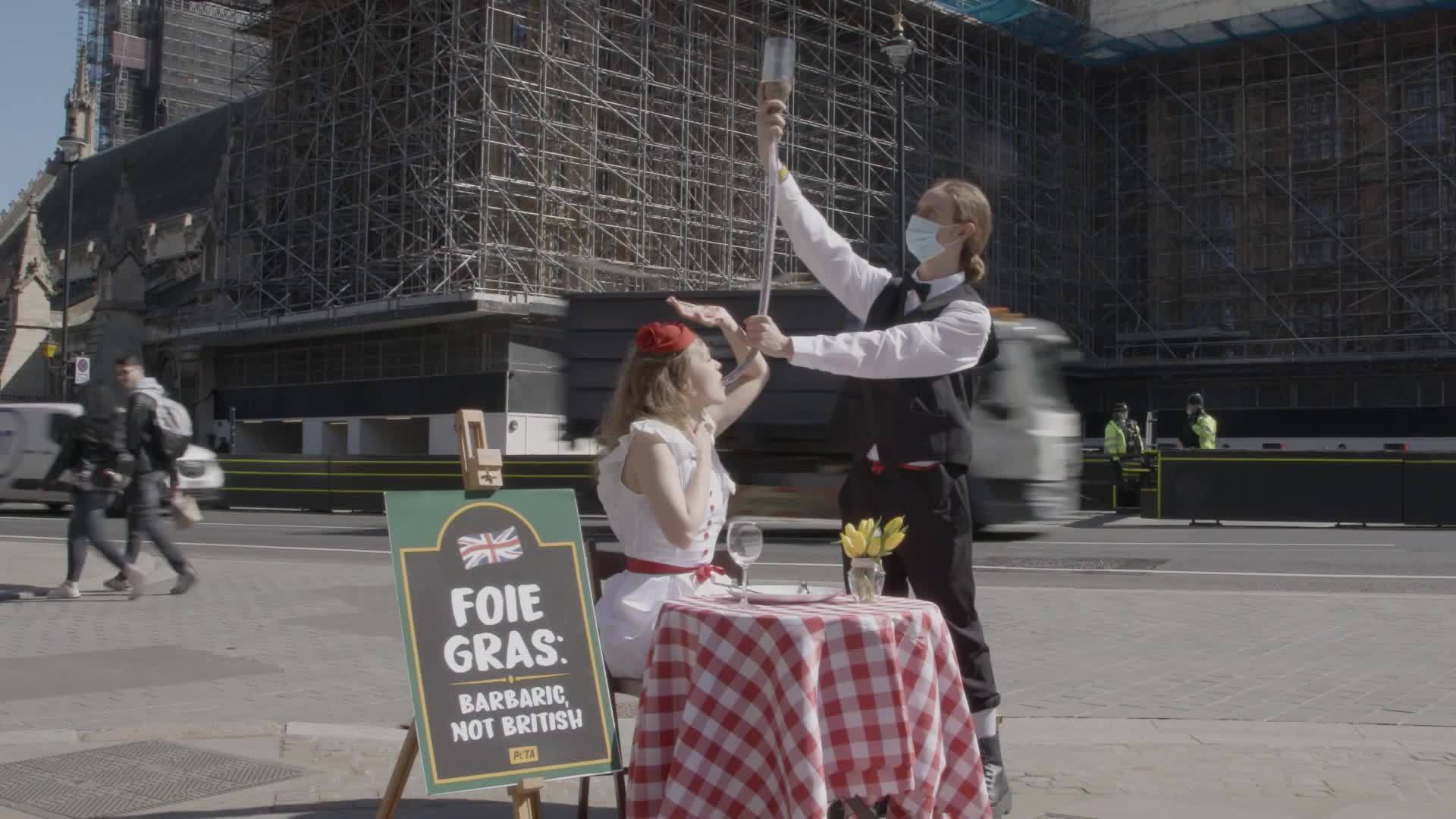UK PETA activists stage forcefeeding foie gras protest outside