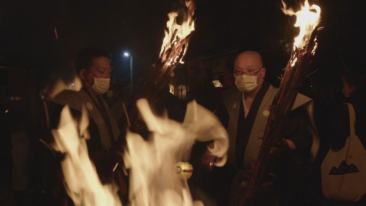 Burning bright: Hundreds carry flaming torches as fire festival returns to Kurama village