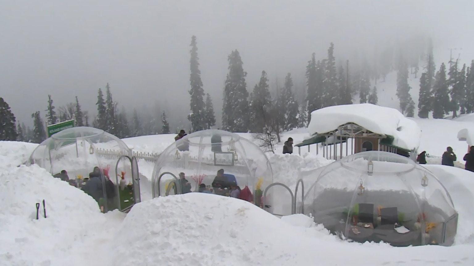 Snow dome dining Glass igloo restaurant delights tourists in mountains