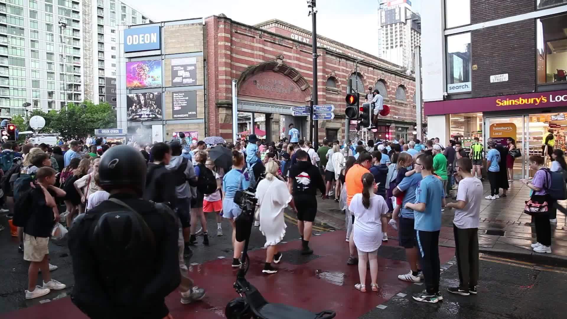 UK: Thousands of Man City fans brave rain to celebrate 'the treble...