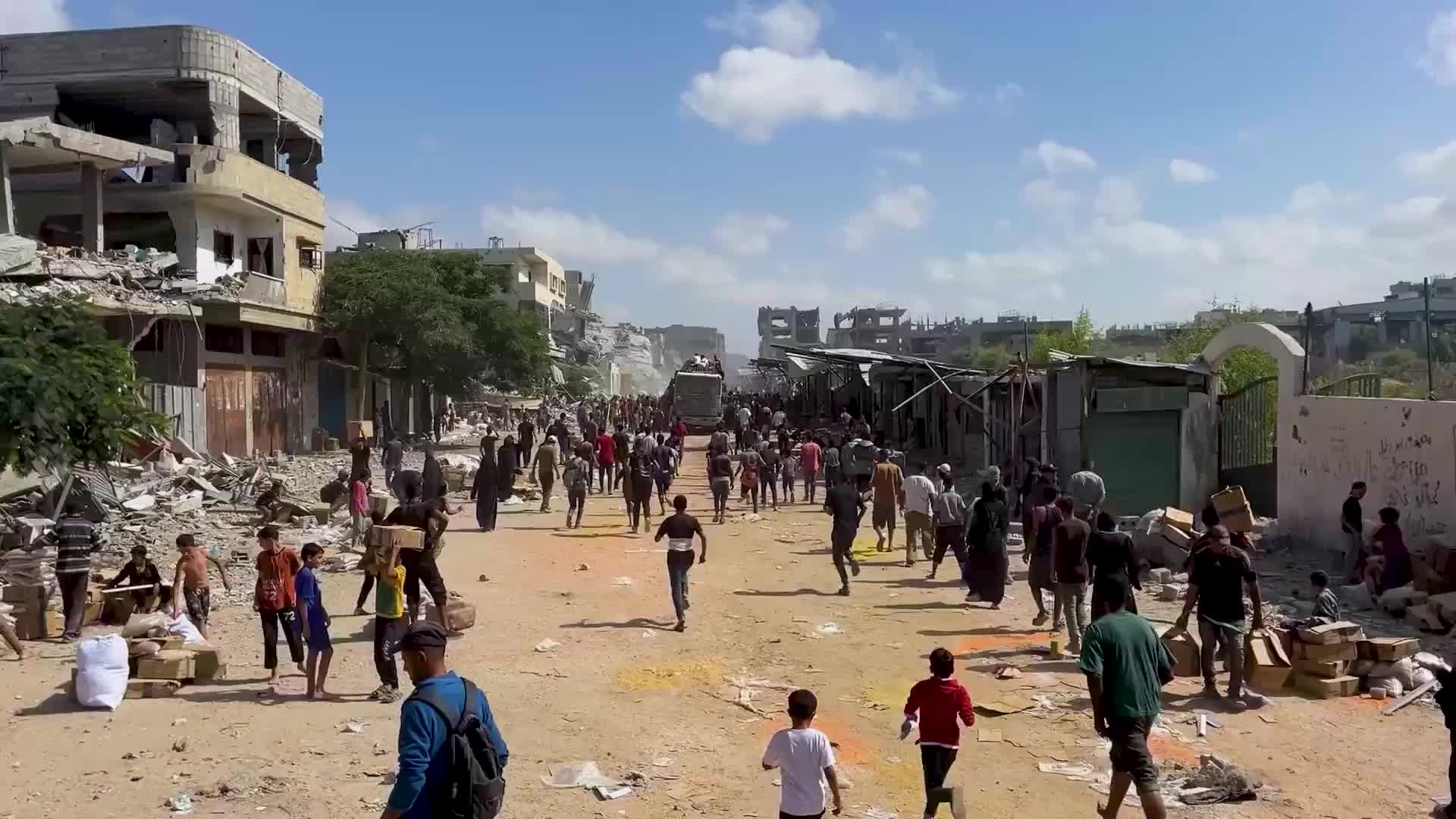 Gaza lifeline - Chaos as crowds surge around aid trucks entering Khan Younis after ceasefire