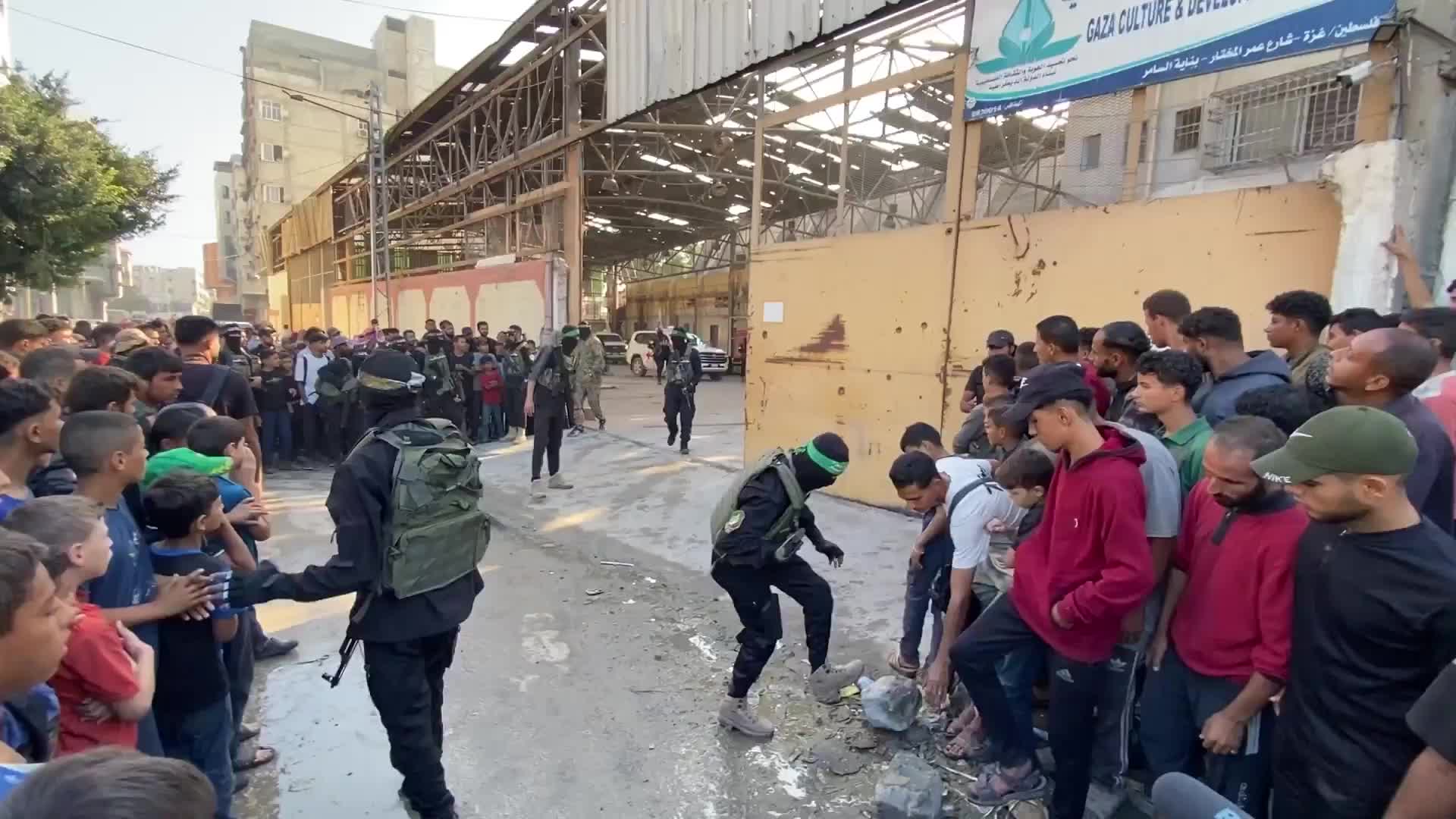 Hamas handover - Masked gunmen pass Israeli hostages to Red Cross *EXCLUSIVE*