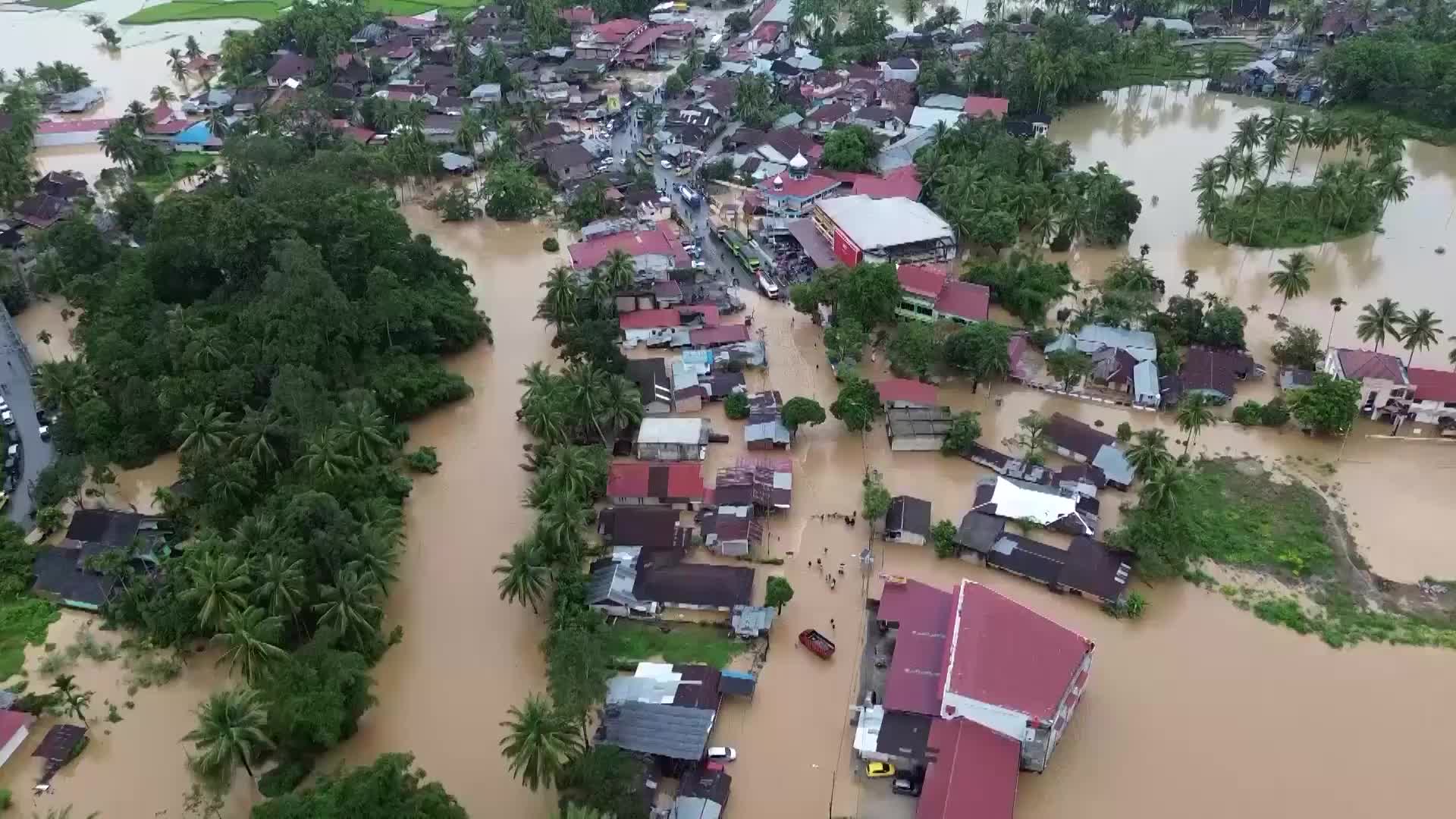 Solok submerged - Floodwaters devastate Indonesian communities, engulfing farmland and homes
