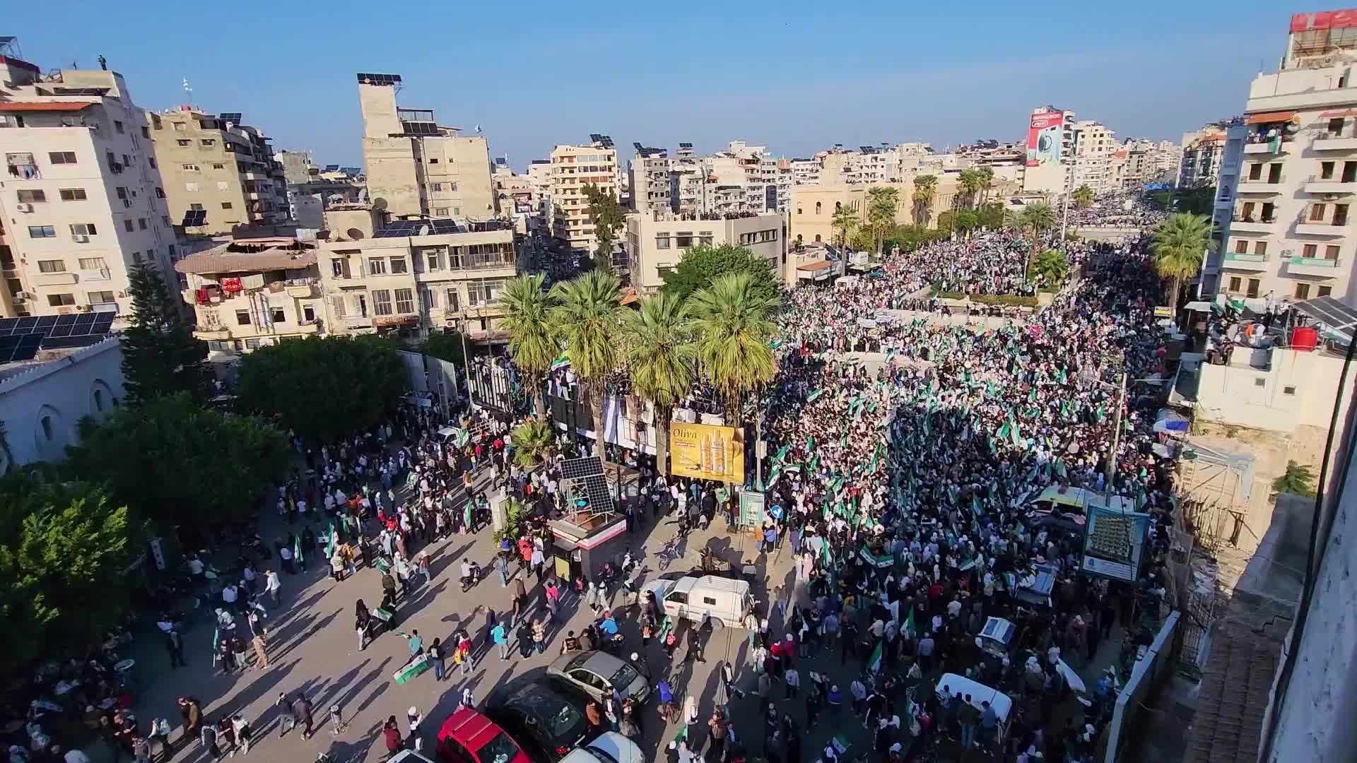 'Celebrating Syria's great victory' - Crowds pack Latakia streets to commemorate transitional govt's first year in power